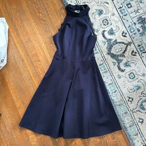 Navy cocktail dress with lace back detail high neck in front